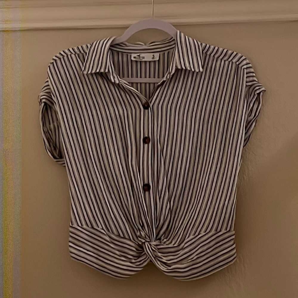 Fancy and can also be casual Hollister top with black and white stripes.
